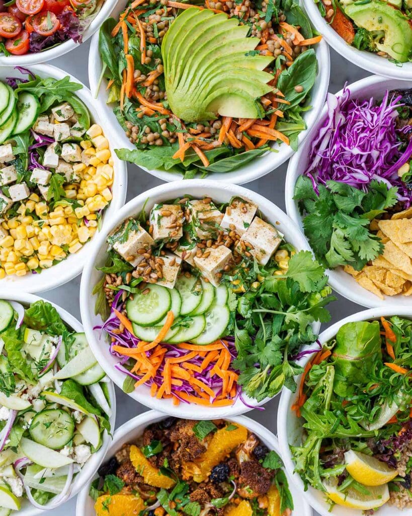 Flat lay of bowls of green salad