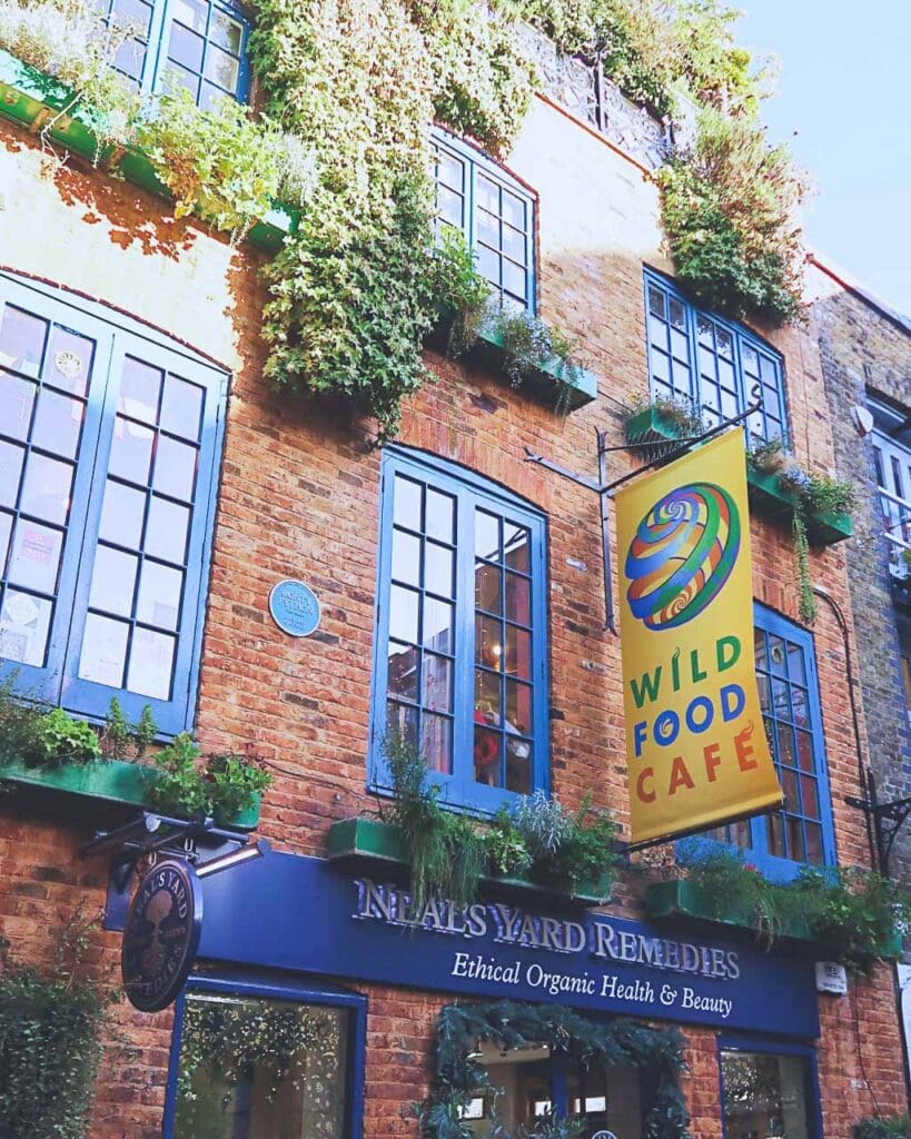 Photo of outside of orange brick building with blue windows in Covent Garden