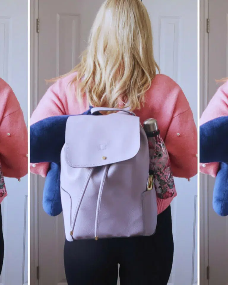 A woman with a lilac rucksack on her back, wearing a pink jumper