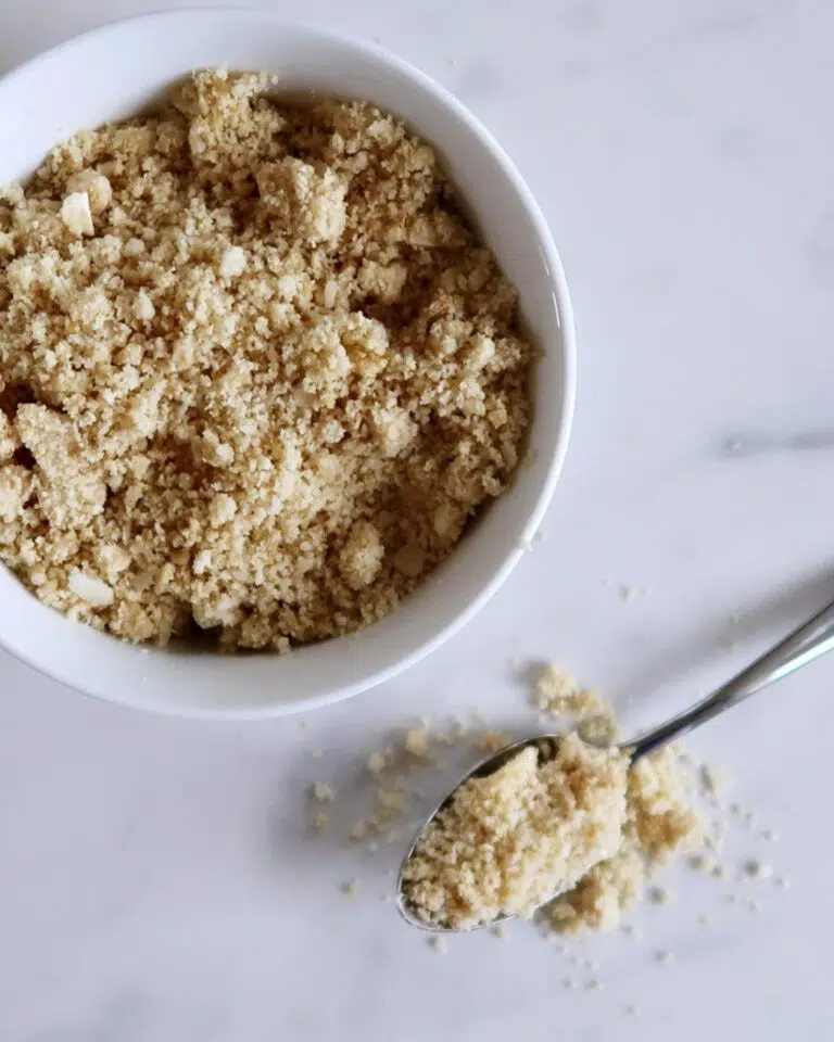 A bowl of crumbly delicious vegan parmesan