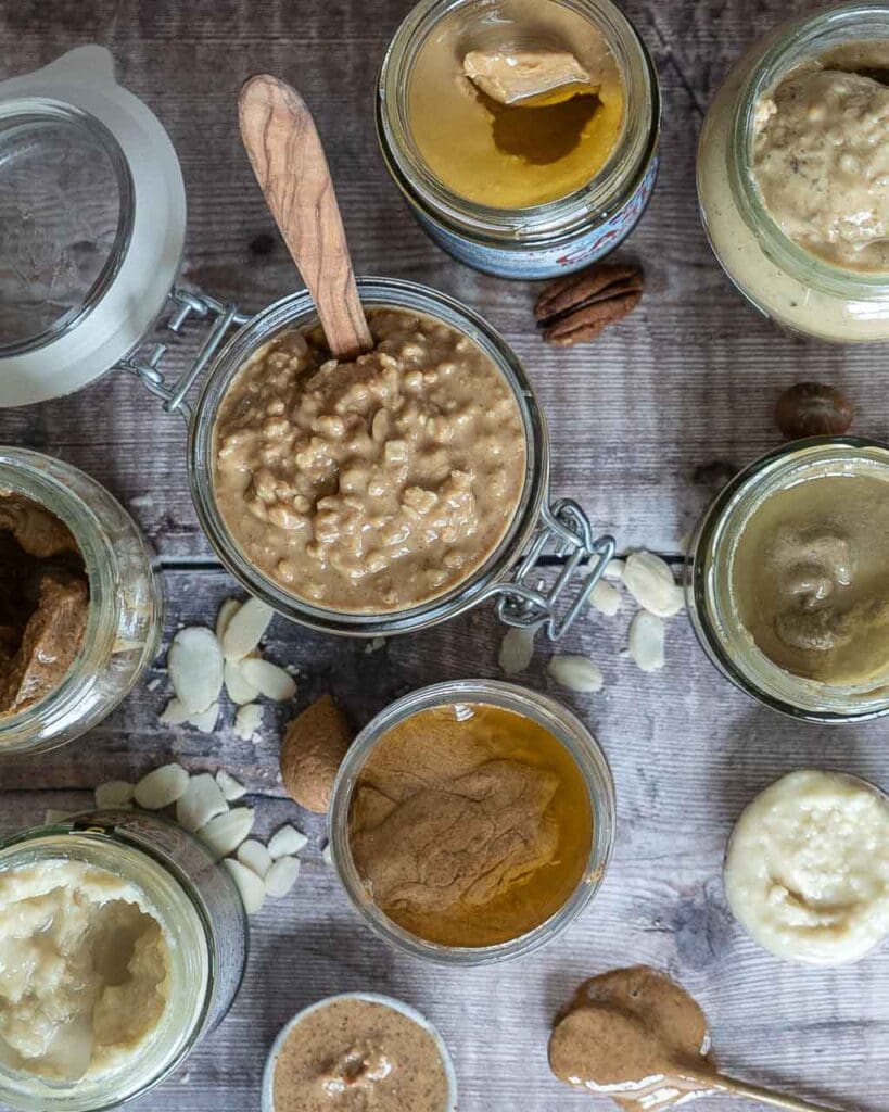 Various jars of nut butter from a top down angle