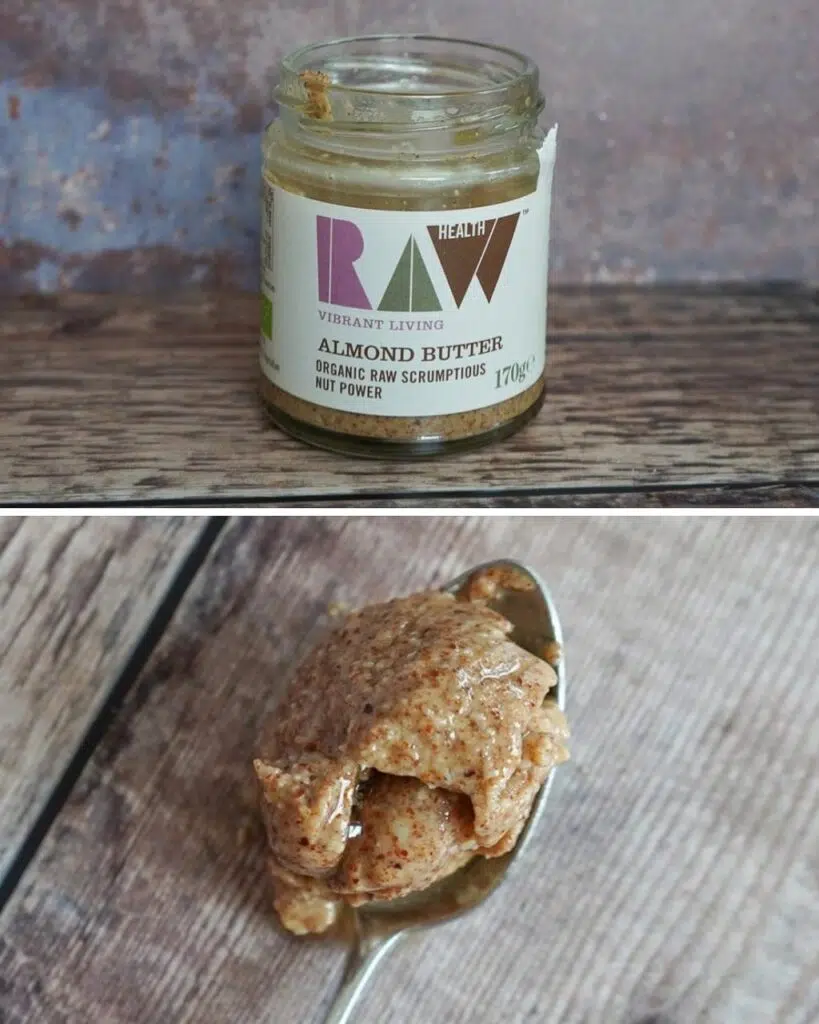 A jar of Raw Health Almond Butter and a spoonful showing the consistency