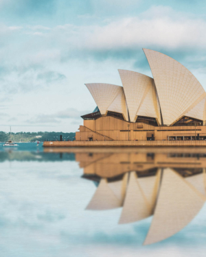 Sydney Opera House at dawn reflecting in the water at Sydney harbour