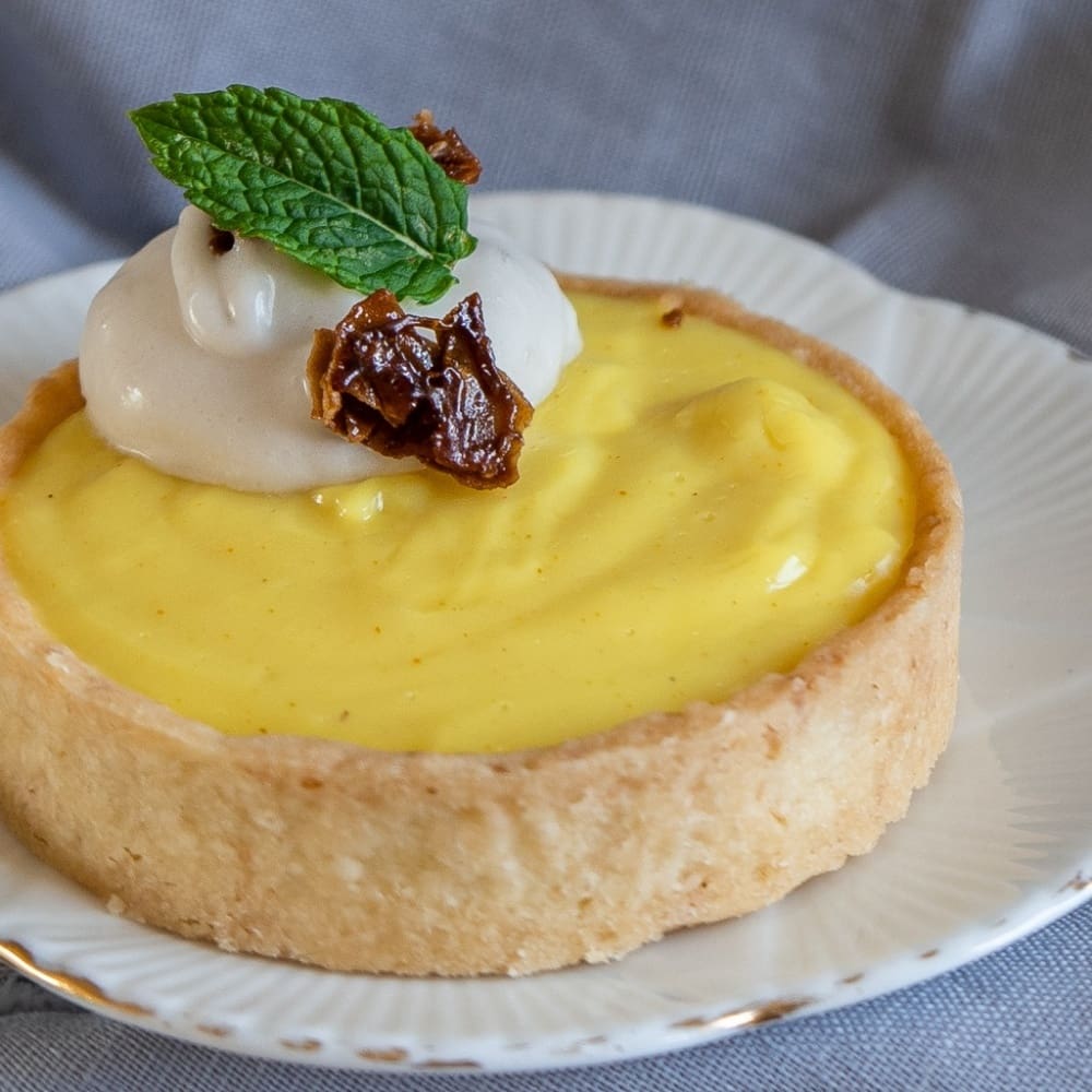 Tangy Lemon Cream Pies with Candied Coconut Flakes