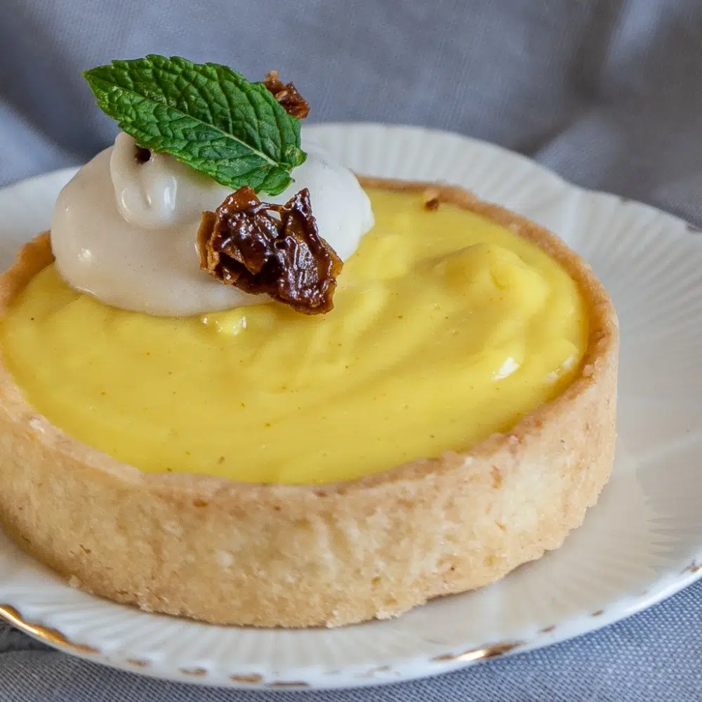 Tangy Lemon Cream Pies with Candied Coconut Flakes