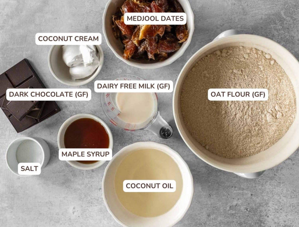 The ingredients needed to make healthy millionaires shortbread, laid out on a table top in bowls