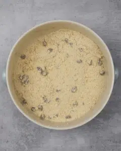 A process shot of making vegan welsh cakes, with the ingredients mixed together in the bowl