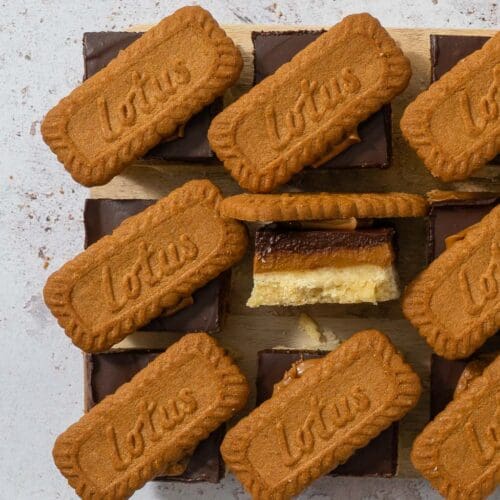 Biscoff Millionaire Shortbread with a trio of layers - vegan shortbread, Biscoff spread and dark chocolate topped with a Lotus Biscoff biscuit