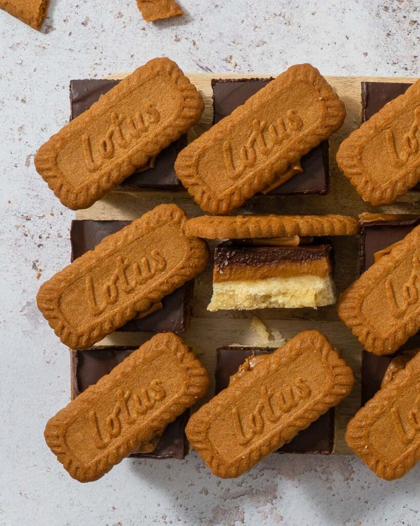 Biscoff Millionaire Shortbread with a trio of layers - vegan shortbread, Biscoff spread and dark chocolate topped with a Lotus Biscoff biscuit