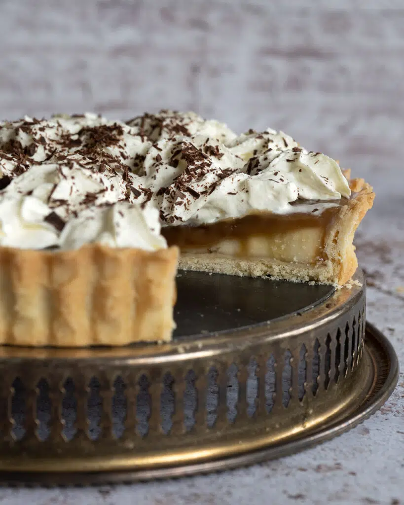 A vegan Banoffee Pie with a slice missing