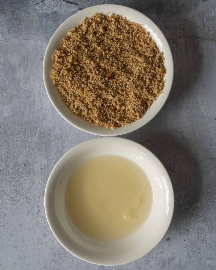 Aquafaba and breadcrumbs in a bowl ready to coat homemade burgers