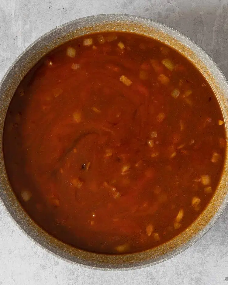 Homemade BBQ sauce being made in a large frying pan