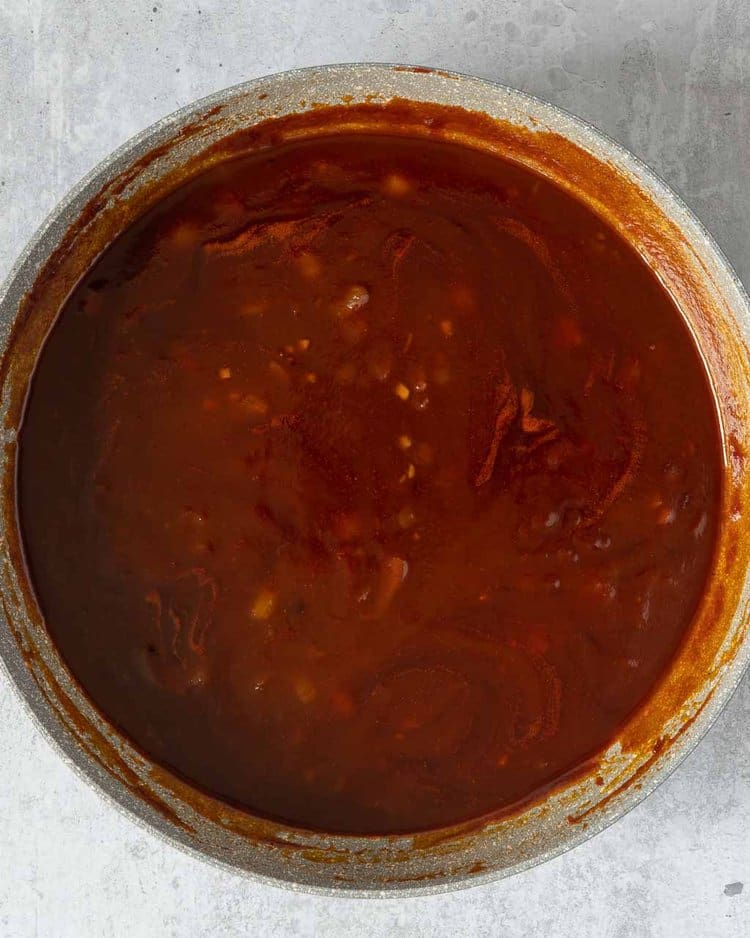 Homemade BBQ sauce being made in a large frying pan