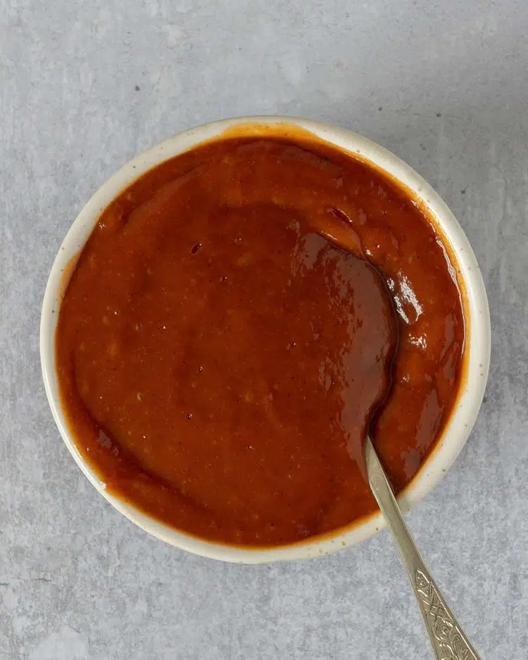 A small bowl of homemade BBQ sauce
