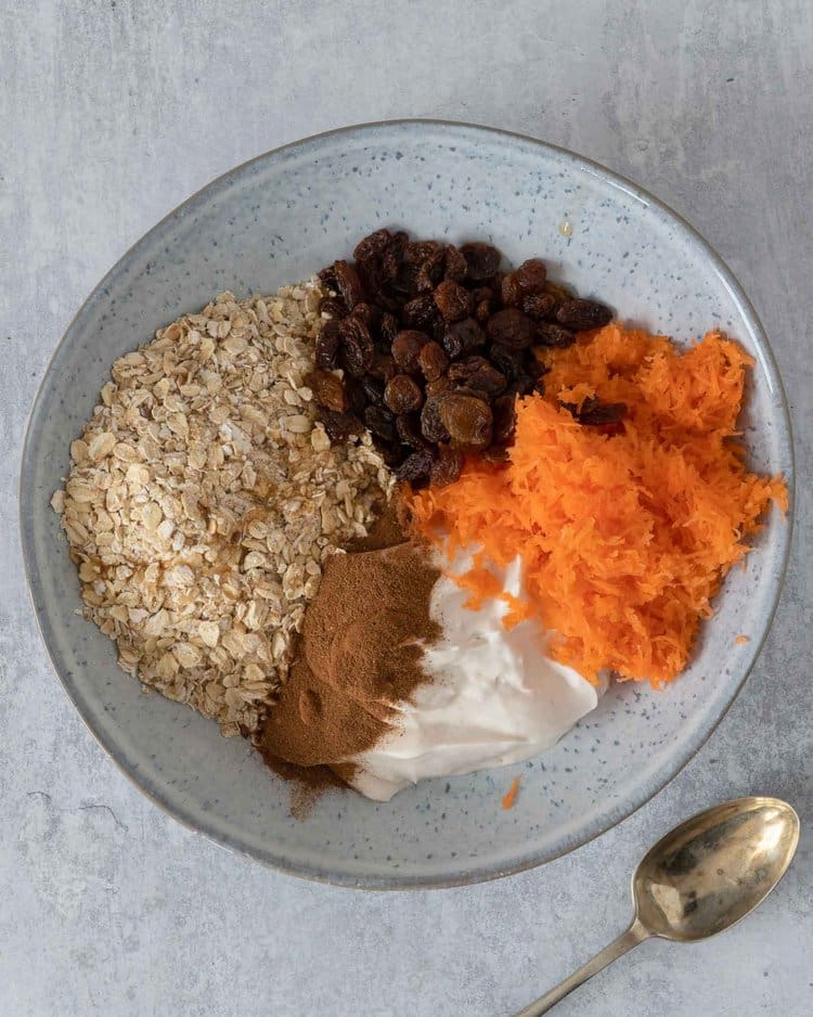 The ingredients for Carrot Cake Bircher ready to be stirred together in a bowl