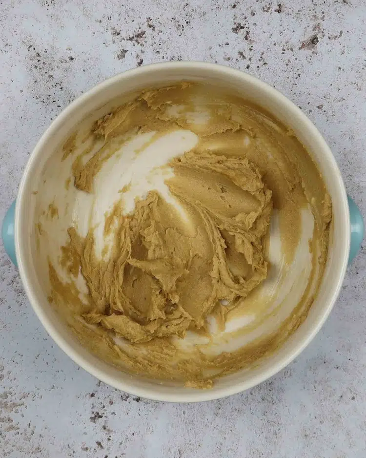 Creamed vegan butter and sugar in a mixing bowl