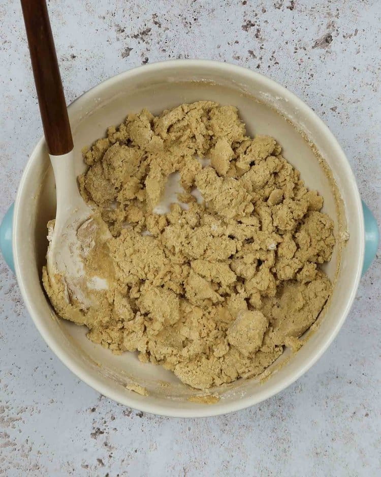 Vegan cookie dough being mixed in a large bowl