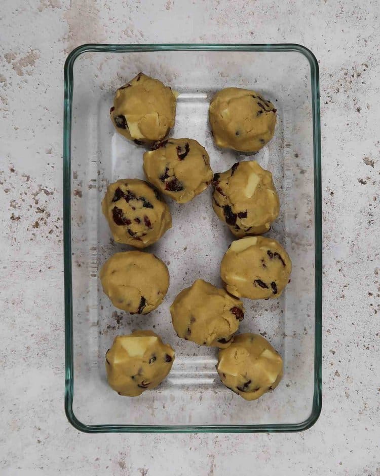 Balls of cookie dough about to be placed in the freezer to chill
