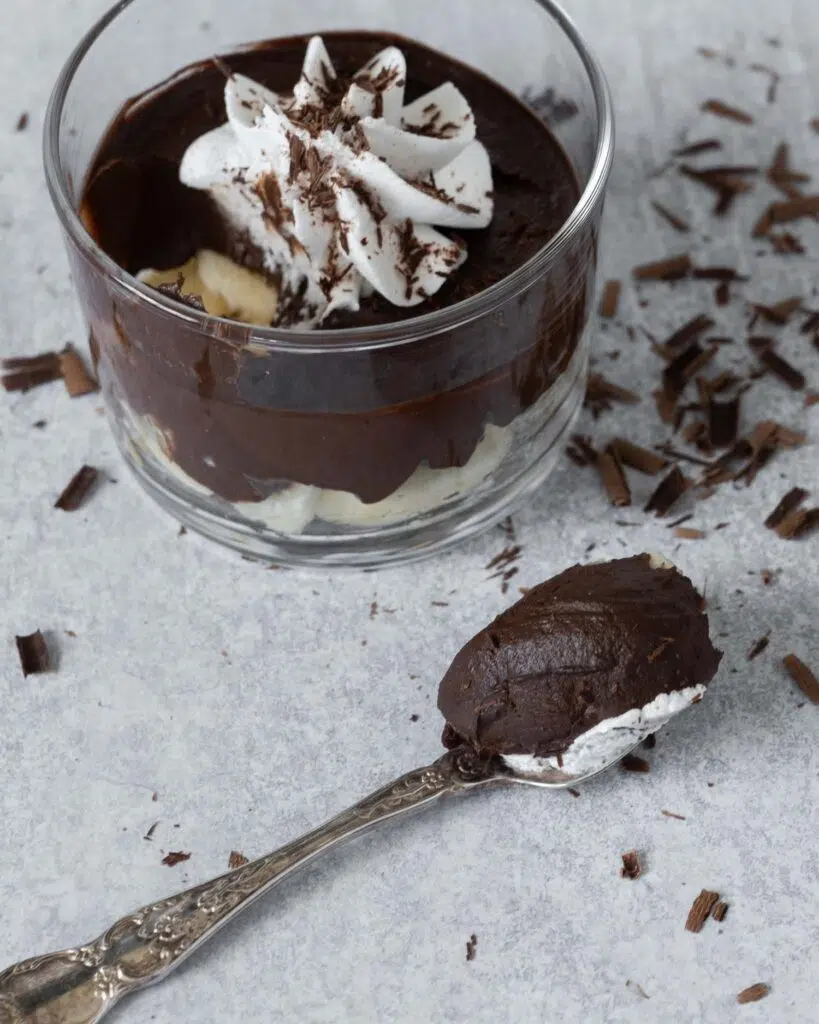 Thick and rich easy chocolate avocado pudding with whipped coconut cream on top
