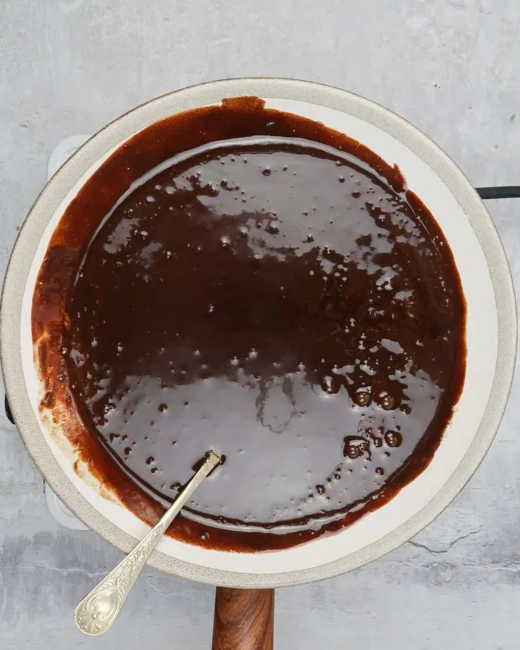 Melted dark chocolate, vegan butter and sugar in a bowl