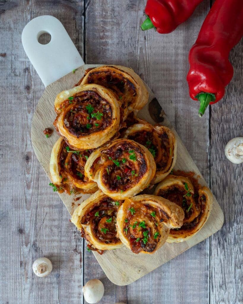 Spirals of puff pastry filled with spicy Mexican veggies and sprinkled with fresh herbs.