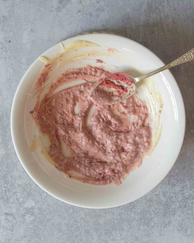 Melted white chocolate and freeze dried raspberry powder stirred together to make a pink raspberry chocolate