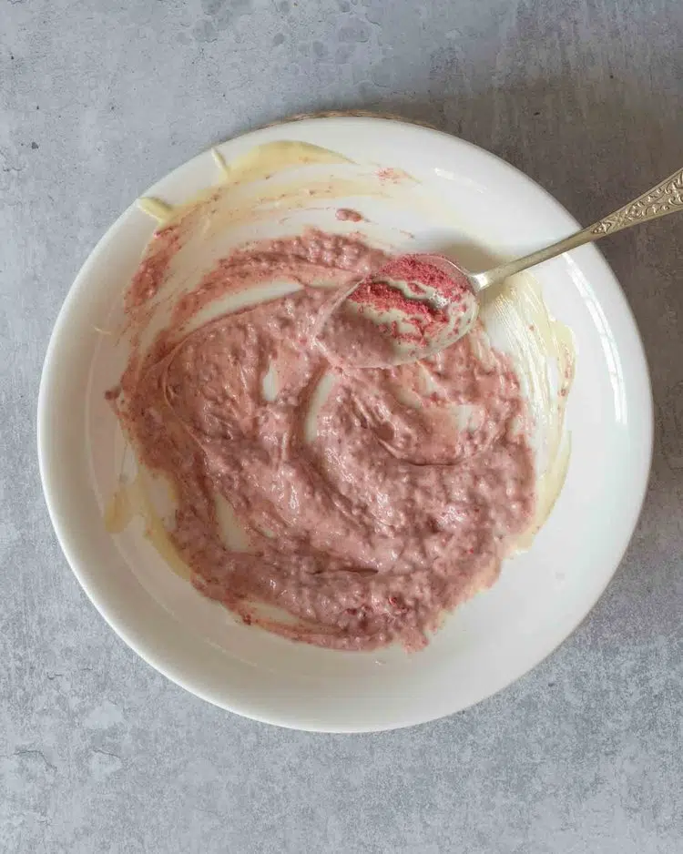 Melted white chocolate and freeze dried raspberry powder stirred together to make a pink raspberry chocolate
