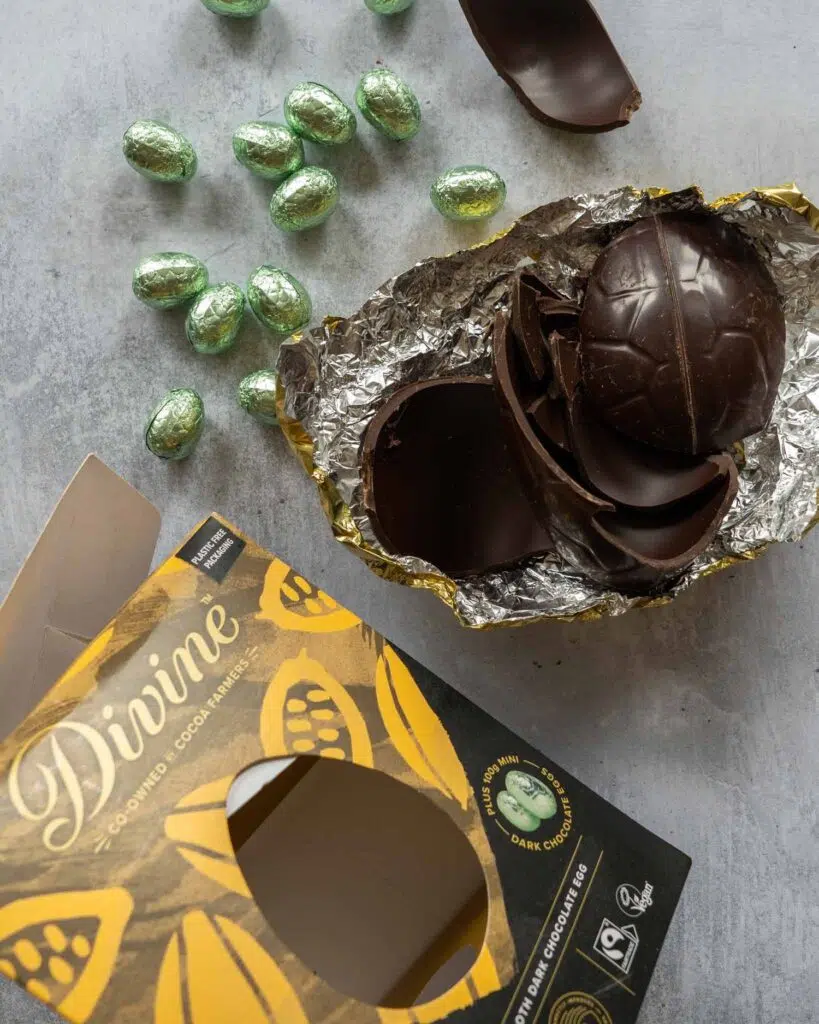 Divine Luxury Dark Chocolate Easter egg broken open on a table top