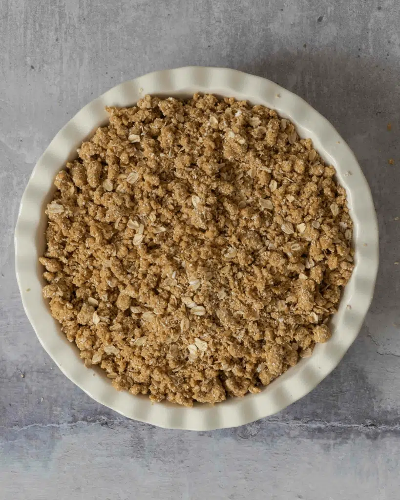 An apple crumble made and ready to be put in the oven to bake.