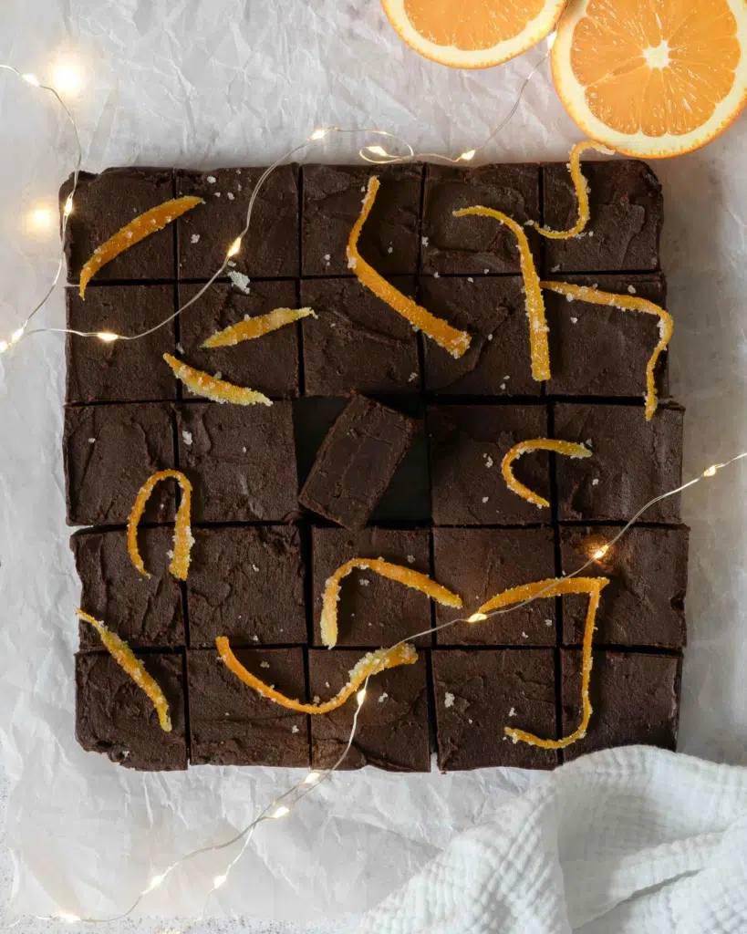5 ingredient fudge cut into squares and decorated with candied orange