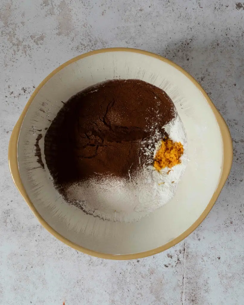 Cocoa, icing sugar and orange zest in a large mixing bowl