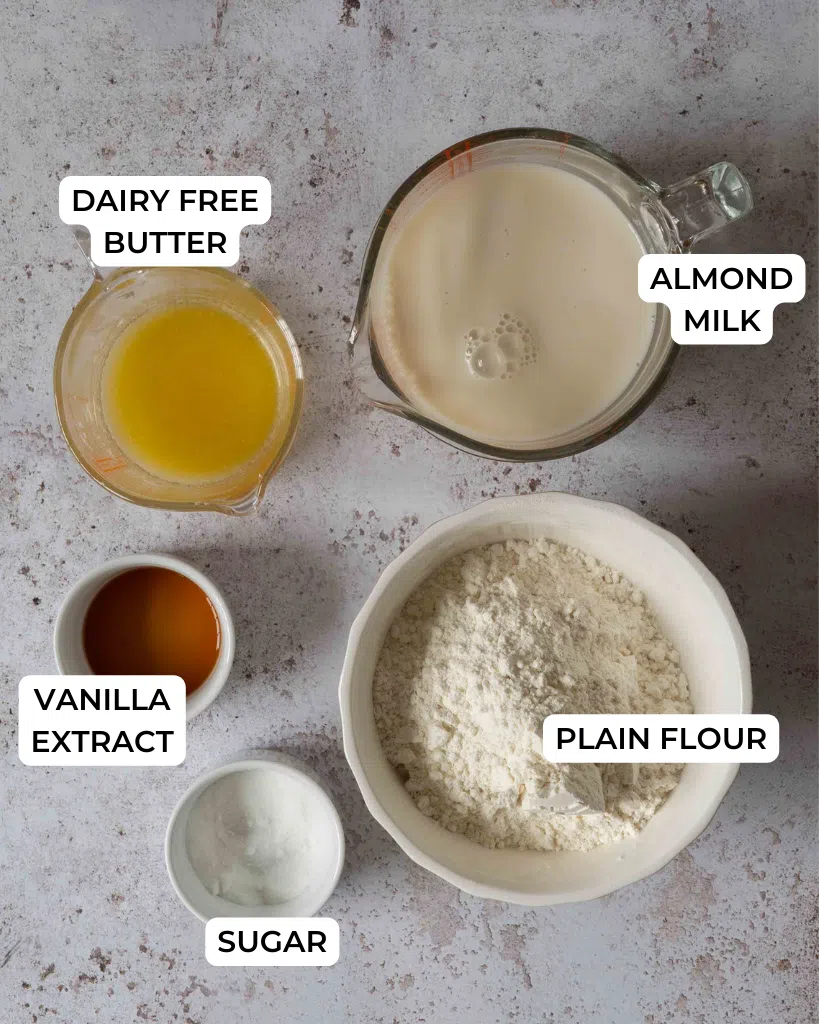 The ingredients needed to make crepes without milk laid out on a table top