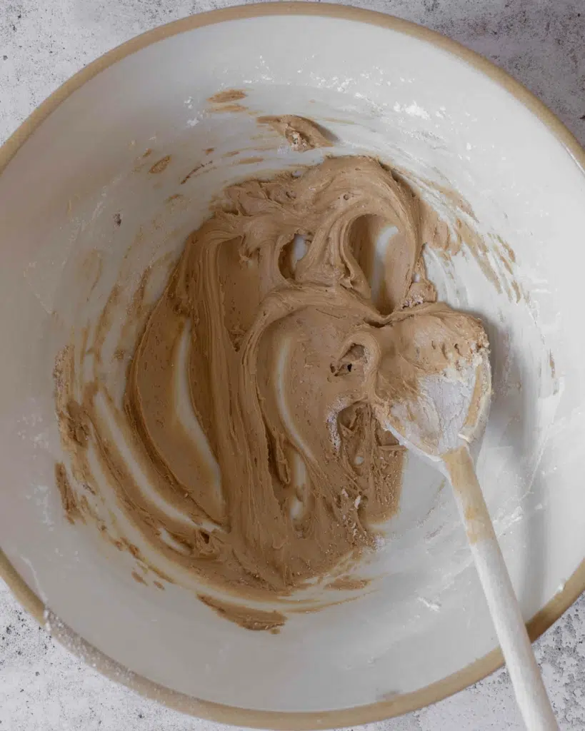 Coffee frosting in a large mixing bowl