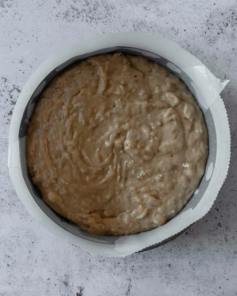 Banana bread batter in a cake tin ready to go in the oven