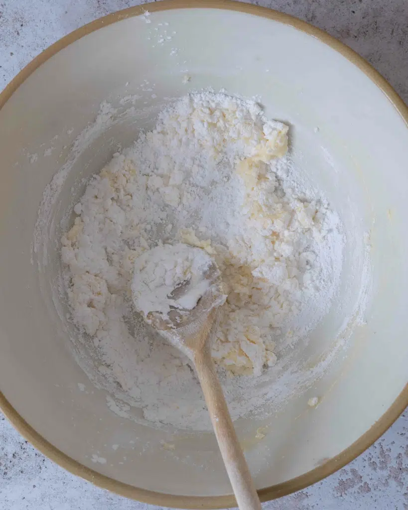 Vegan cream cheese, butter and icing sugar in a bowl