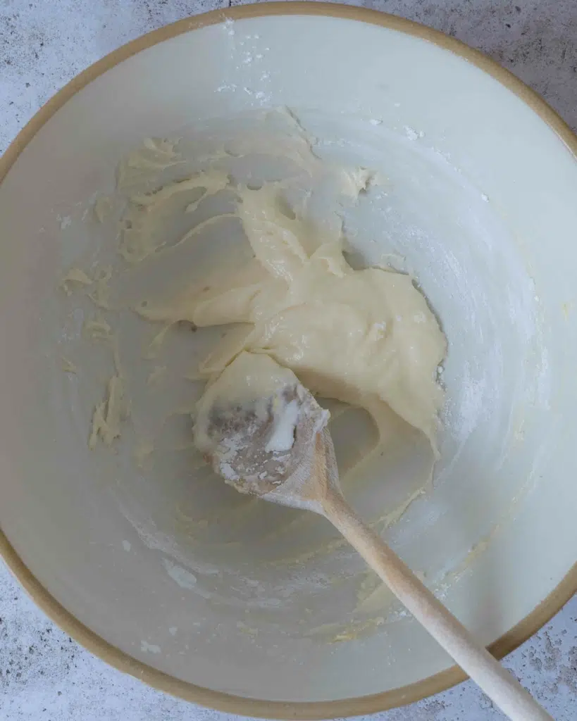 Vegan cream cheese frosting in a large mixing bowl