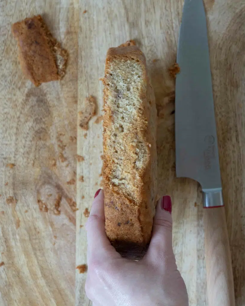 A baked banana bread with the edge trimmed off