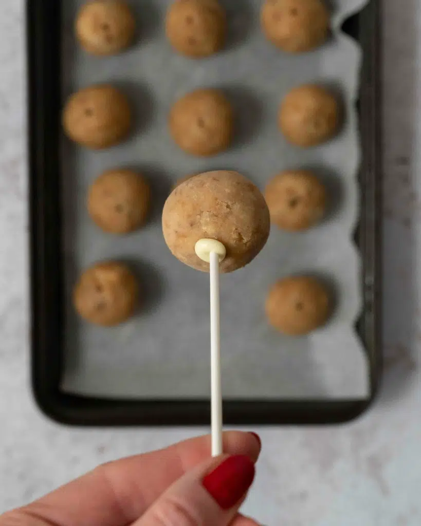 A banana bread cake pop being made