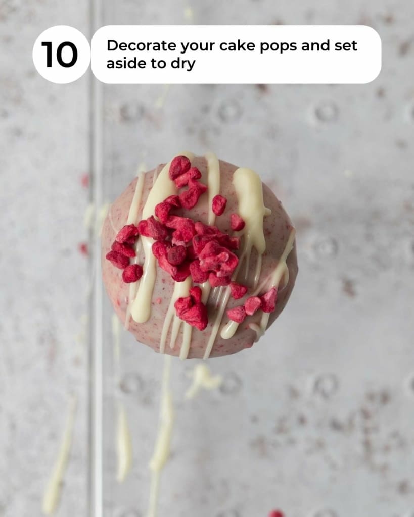 A raspberry white chocolate cake pop topped with freeze dried raspberries.
