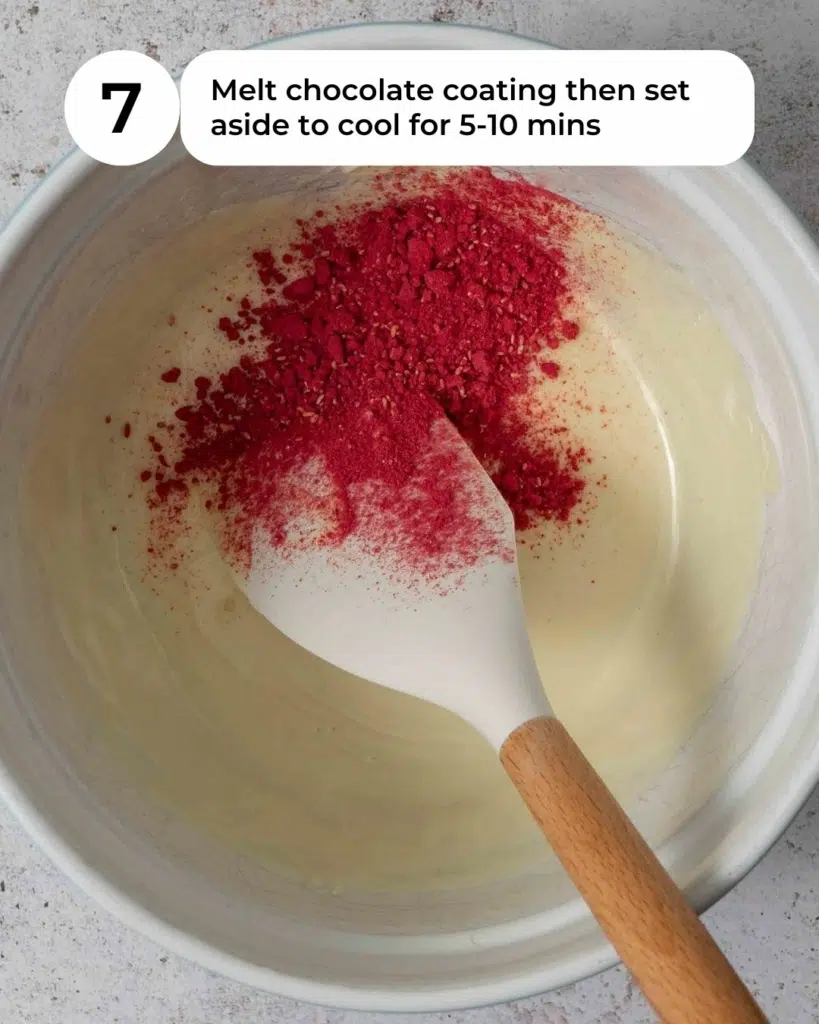 A bowl of melted vegan white chocolate and freeze dried raspberry powder ready to be made into raspberry white chocolate.