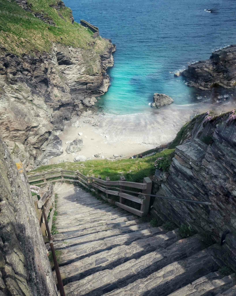 Wooden steps going down to a private beach in Cornwall
