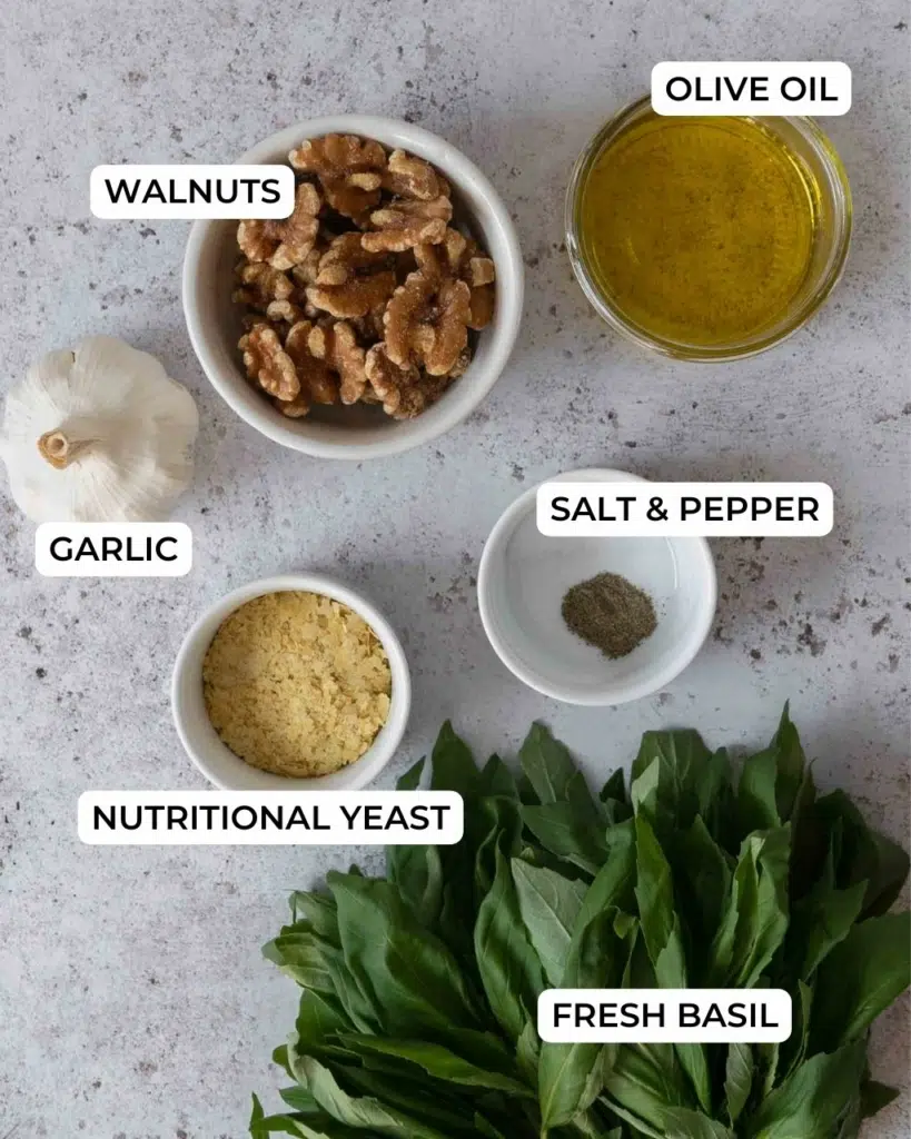 The ingredients for making vegan basil walnut pesto