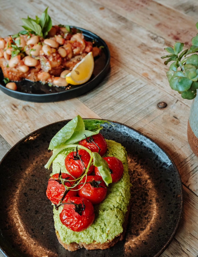 Avocado on toast and smashed beans on toast