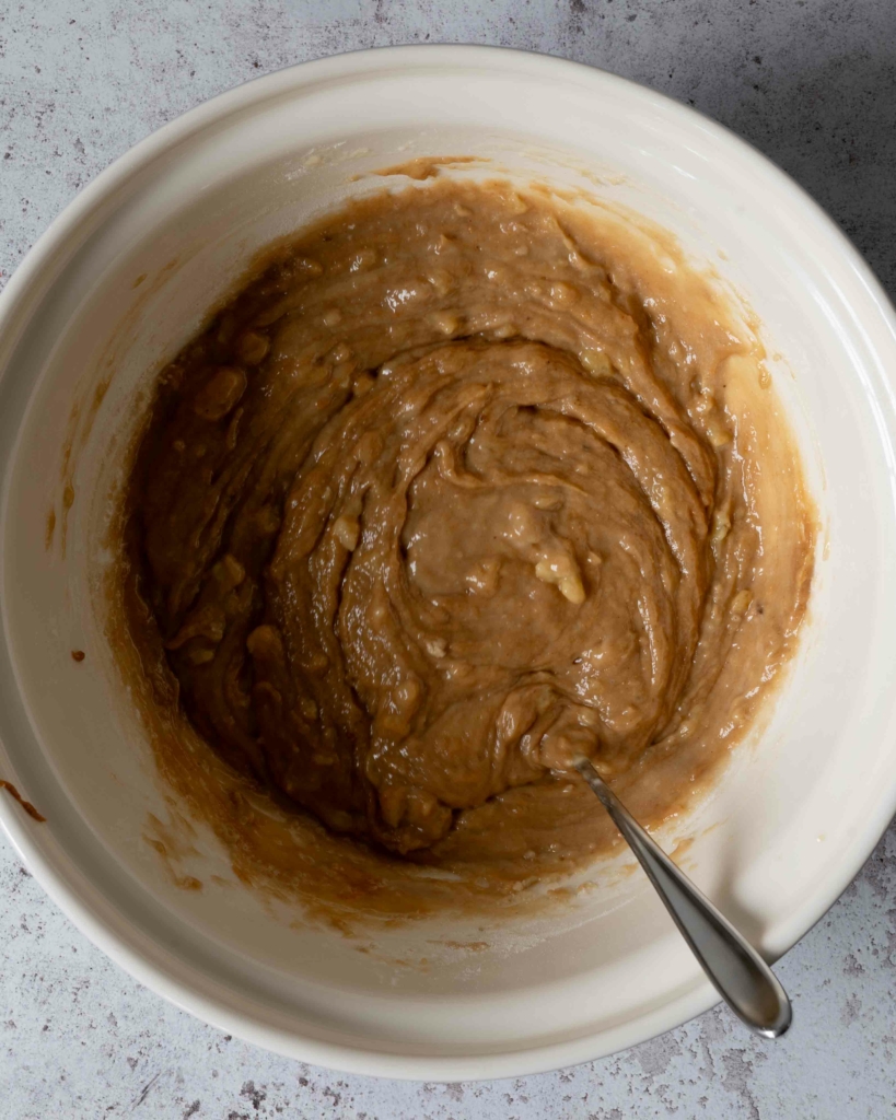 Banana bread batter in a large mixing bowl