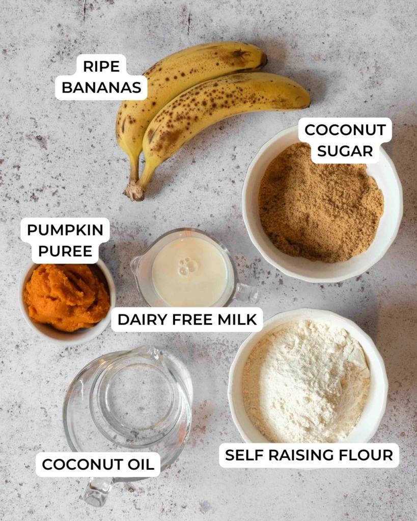 The ingredients for making banana pumpkin bread laid out on a table