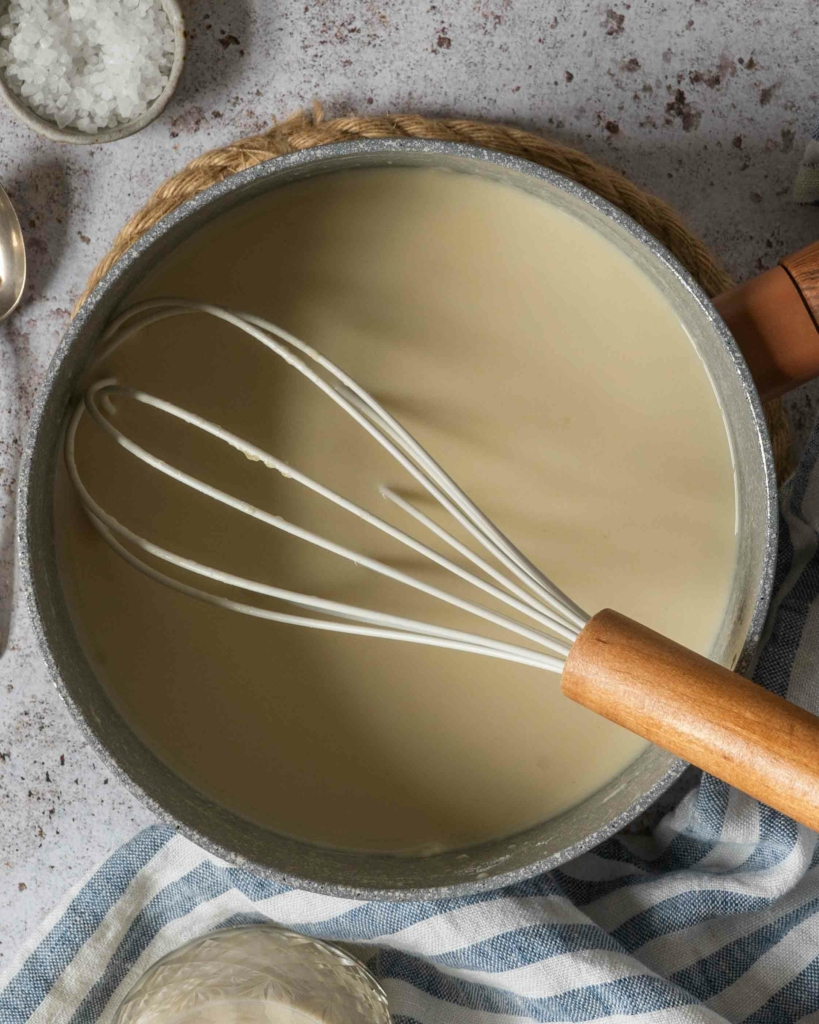 Vegan white sauce in a saucepan