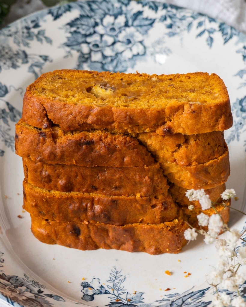 A stack of vegan banana pumpkin bread on a pretty floral plate