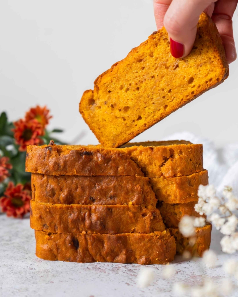 A stack of vegan banana pumpkin bread on a pretty floral plate