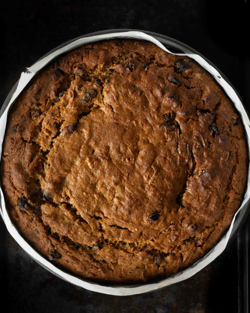 A freshly baked Christmas carrot cake still in the cake tin