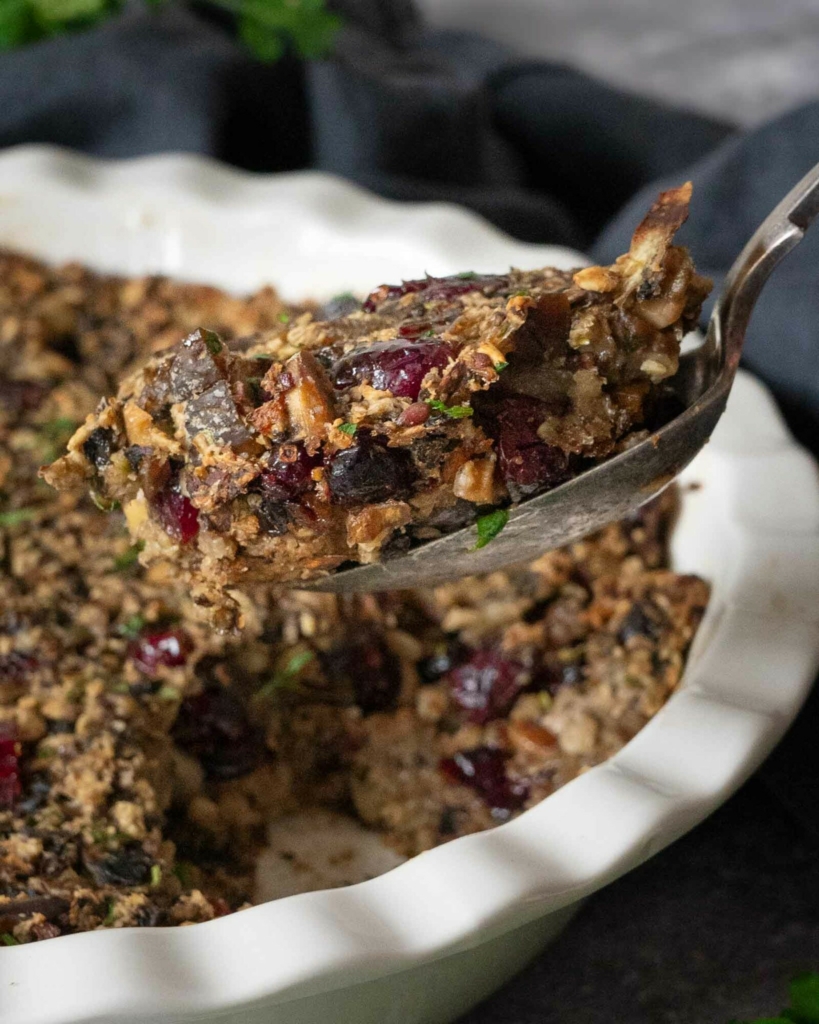 A spoonful of vegan chestnut stuffing being dished up